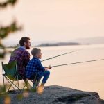 Parent helping child choose the right kids fishing pole for beginners