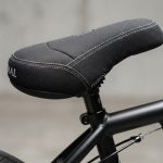 Thick padded fat BMX bike seat mounted on frame.